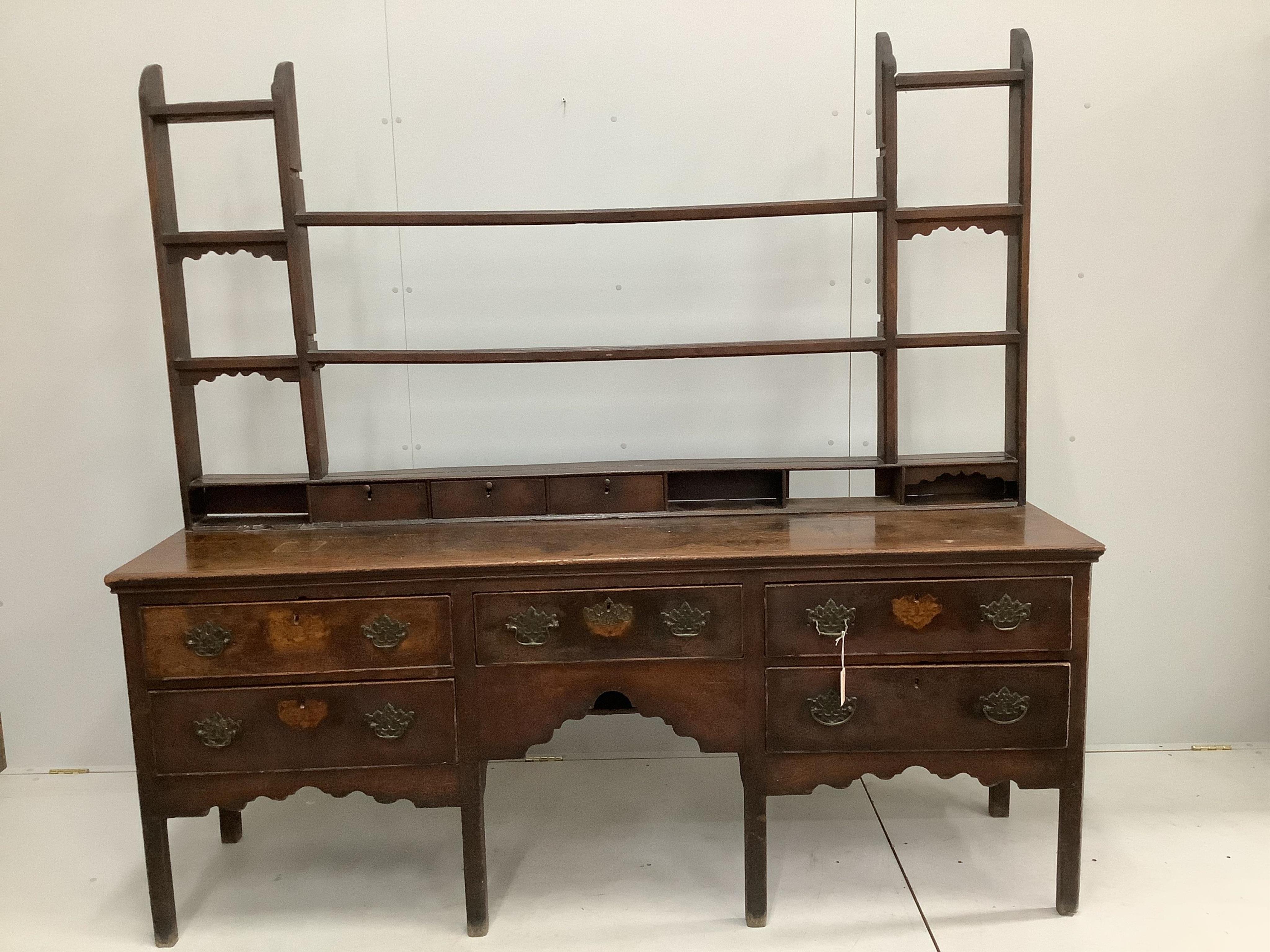 An 18th century oak dresser with adapted rack, width 200cm, depth 51cm, height 81cm